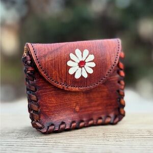 Elegant Brown Leather Coin Purse with Floral Accent